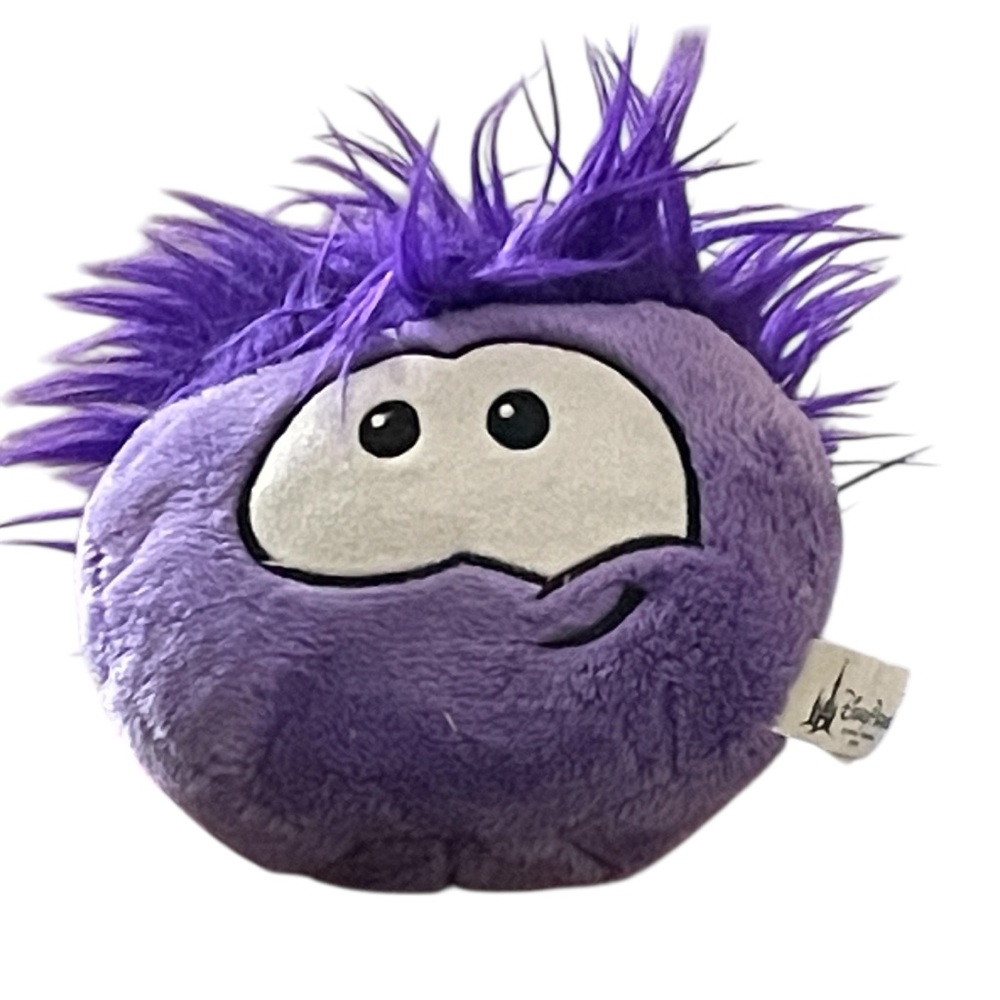 DISNEY Puffle purple plush toy with spiky hair and smirk DisneyWorld park club